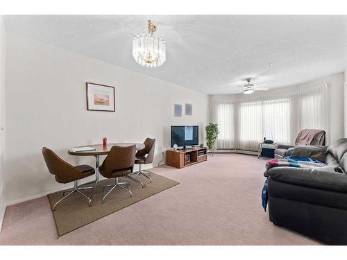 3415-3000 Hawksbrow Point Nw, Calgary, AB - Indoor Photo Showing Living Room