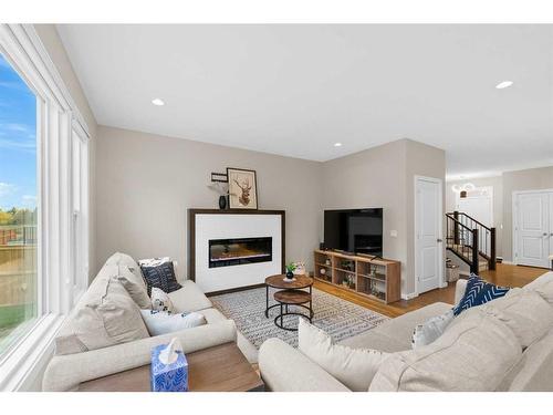 265 Sandpiper Crescent, Chestermere, AB - Indoor Photo Showing Living Room With Fireplace