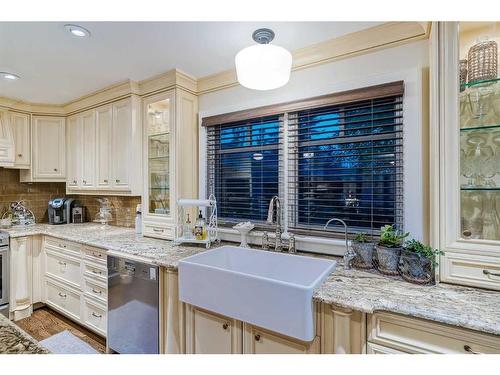 12240 Lake Louise Way Se, Calgary, AB - Indoor Photo Showing Kitchen With Double Sink