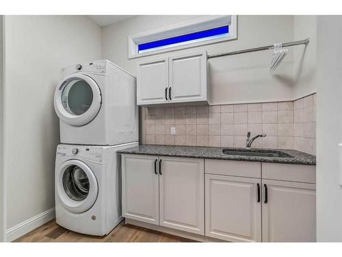 199 Crawford Drive, Cochrane, AB - Indoor Photo Showing Laundry Room