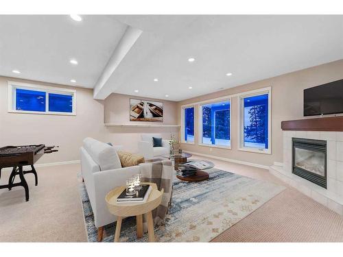 199 Crawford Drive, Cochrane, AB - Indoor Photo Showing Living Room With Fireplace
