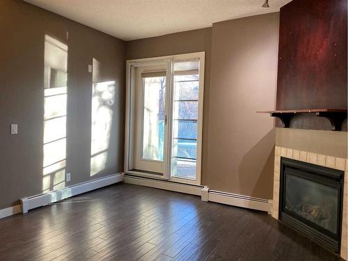 103-108 25 Avenue Sw, Calgary, AB - Indoor With Fireplace