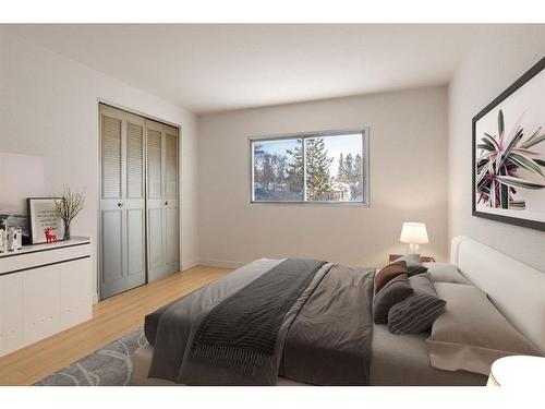 209 Sunset Boulevard Sw, Diamond Valley, AB - Indoor Photo Showing Bedroom
