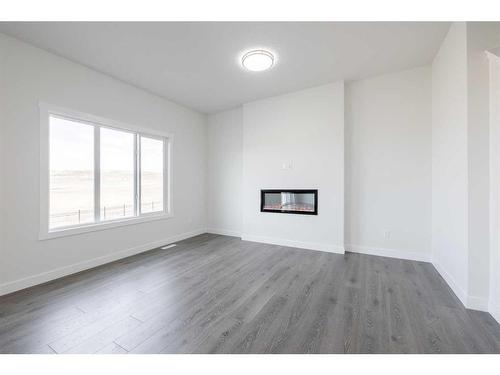 164 Sunrise Common, Cochrane, AB - Indoor With Fireplace