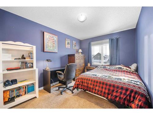 8 Sunset View, Cochrane, AB - Indoor Photo Showing Bedroom
