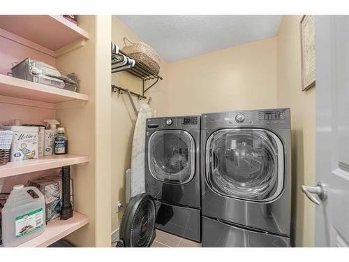 8 Sunset View, Cochrane, AB - Indoor Photo Showing Laundry Room