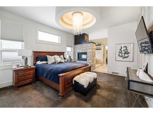 7 Wexford Crescent Sw, Calgary, AB - Indoor Photo Showing Bedroom With Fireplace