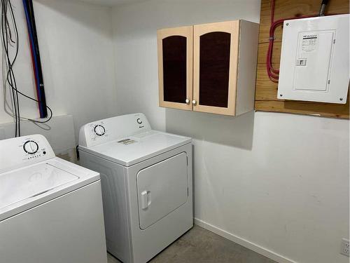 2201 22 Street, Nanton, AB - Indoor Photo Showing Laundry Room