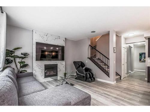 196 Dawson Harbour Heights, Chestermere, AB - Indoor Photo Showing Living Room With Fireplace