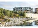 101-190 Marina Cove Se, Calgary, AB  - Outdoor With Body Of Water 