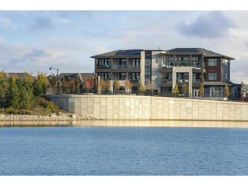 101-190 Marina Cove Se, Calgary, AB - Outdoor With Body Of Water