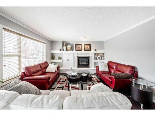 375 Wentworth Place Sw, Calgary, AB - Indoor Photo Showing Living Room With Fireplace