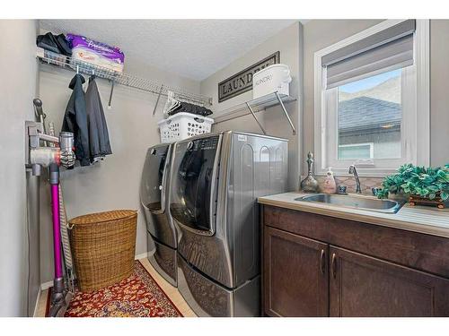 121 Masters Cape Se, Calgary, AB - Indoor Photo Showing Laundry Room