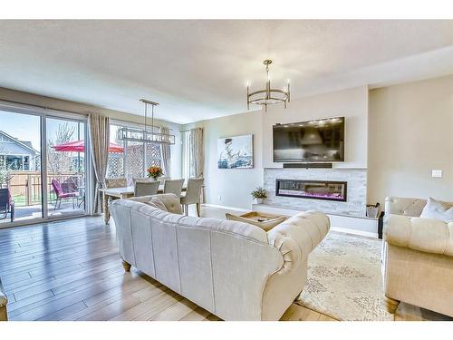 46 Cranbrook Cove Se, Calgary, AB - Indoor Photo Showing Living Room With Fireplace