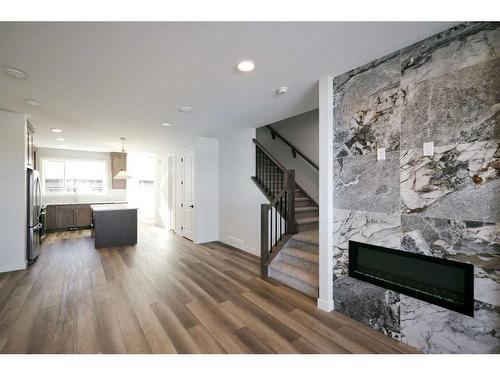 141 Treeline Avenue Sw, Calgary, AB - Indoor Photo Showing Living Room With Fireplace