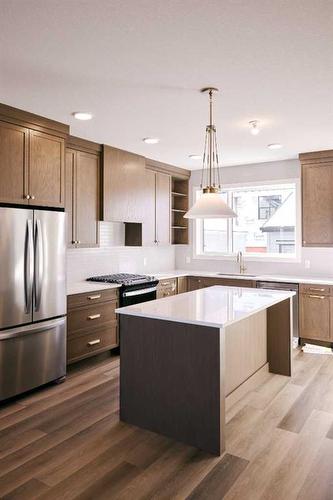 141 Treeline Avenue Sw, Calgary, AB - Indoor Photo Showing Kitchen With Stainless Steel Kitchen With Upgraded Kitchen