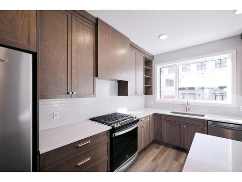 141 Treeline Avenue Sw, Calgary, AB - Indoor Photo Showing Kitchen With Upgraded Kitchen