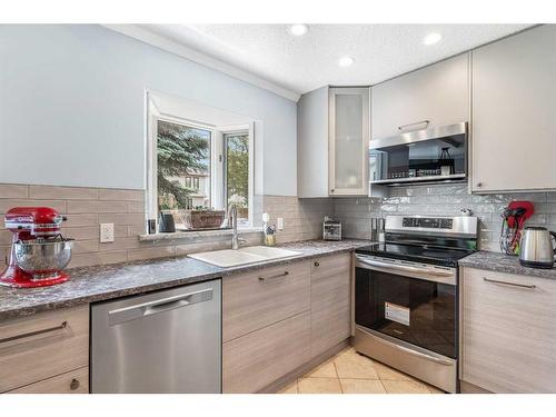 116 Sun Harbour Crescent Se, Calgary, AB - Indoor Photo Showing Kitchen With Stainless Steel Kitchen With Upgraded Kitchen
