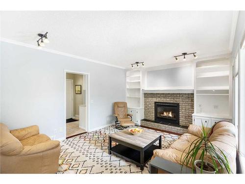 116 Sun Harbour Crescent Se, Calgary, AB - Indoor Photo Showing Living Room With Fireplace