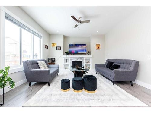 162 Kinniburgh Crescent, Chestermere, AB - Indoor Photo Showing Living Room With Fireplace
