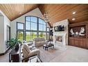 242036 96 Street East, Rural Foothills County, AB  - Indoor Photo Showing Living Room With Fireplace 