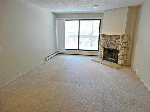 324-10120 Brookpark Boulevard Sw, Calgary, AB - Indoor With Fireplace