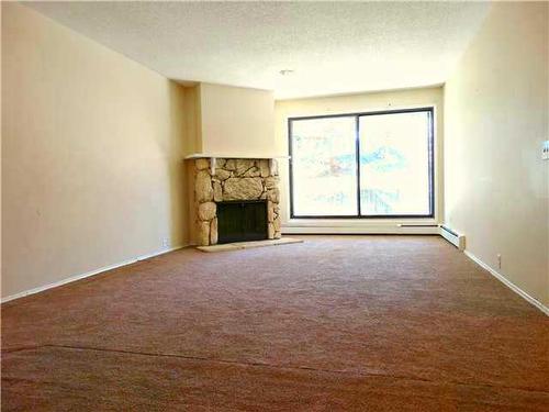 123-10120 Brookpark Boulevard Sw, Calgary, AB - Indoor Photo Showing Other Room With Fireplace