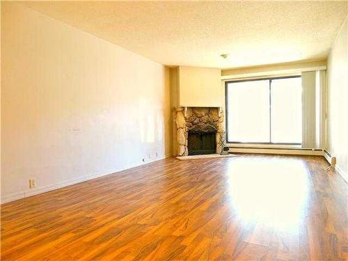 115-10120 Brookpark Boulevard Sw, Calgary, AB - Indoor Photo Showing Other Room With Fireplace