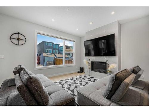 628 Livingston Way Ne, Calgary, AB - Indoor Photo Showing Living Room With Fireplace