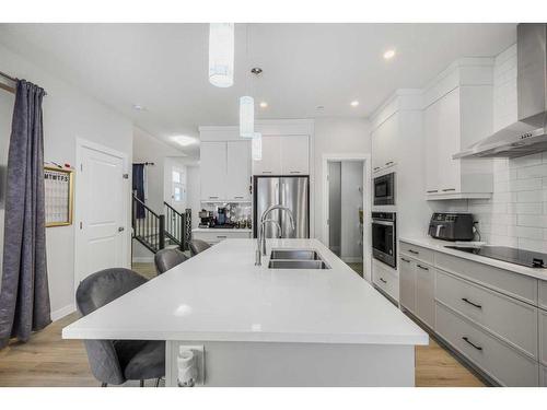 628 Livingston Way Ne, Calgary, AB - Indoor Photo Showing Kitchen With Double Sink With Upgraded Kitchen