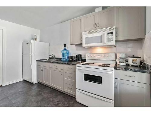 1406 Montrose Terrace Se, High River, AB - Indoor Photo Showing Kitchen With Double Sink
