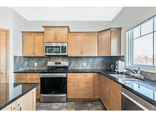 1406 Montrose Terrace Se, High River, AB - Indoor Photo Showing Kitchen With Double Sink