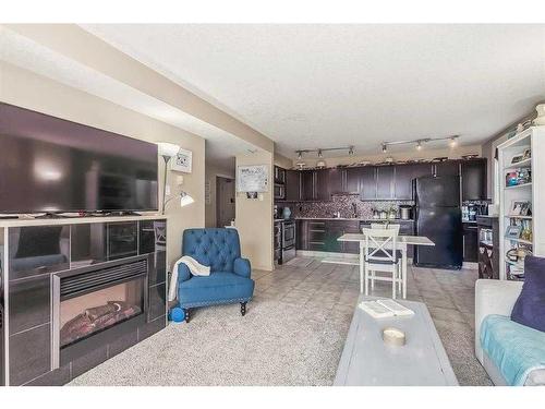 407-429 14 Street Nw, Calgary, AB - Indoor Photo Showing Living Room With Fireplace