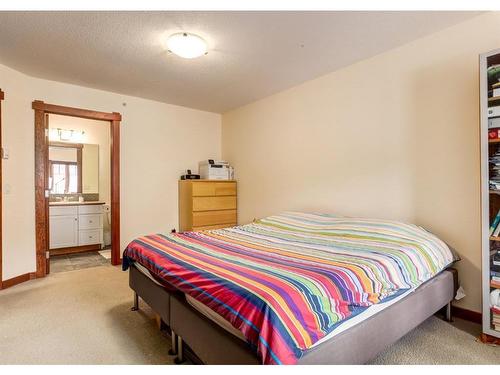 319-170 Crossbow Place, Canmore, AB - Indoor Photo Showing Bedroom