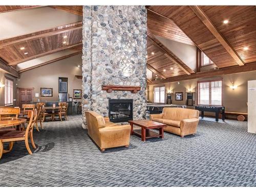 319-170 Crossbow Place, Canmore, AB - Indoor With Fireplace