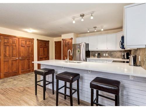 319-170 Crossbow Place, Canmore, AB - Indoor Photo Showing Kitchen With Upgraded Kitchen