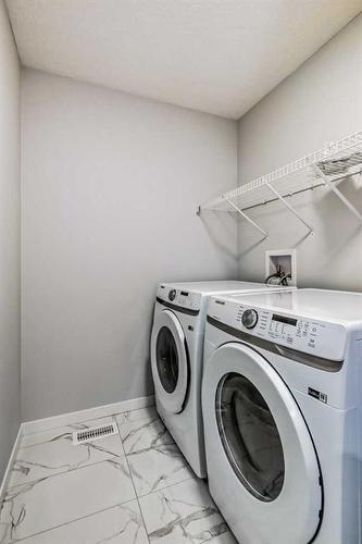 190 Lucas Close Nw, Calgary, AB - Indoor Photo Showing Laundry Room