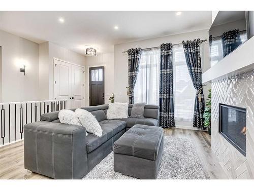 537 Marine Drive Se, Calgary, AB - Indoor Photo Showing Living Room With Fireplace