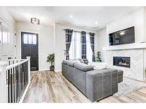 537 Marine Drive Se, Calgary, AB - Indoor Photo Showing Living Room With Fireplace