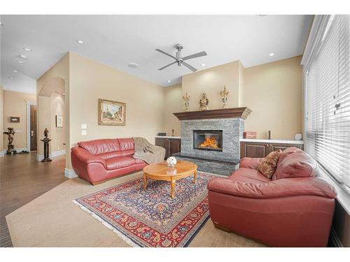 235 Coopers Hill Sw, Airdrie, AB - Indoor Photo Showing Living Room With Fireplace