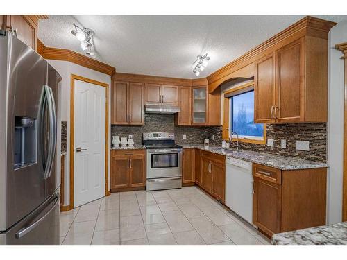30 Rocky Ridge Landing Nw, Calgary, AB - Indoor Photo Showing Kitchen With Double Sink