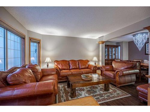 30 Rocky Ridge Landing Nw, Calgary, AB - Indoor Photo Showing Living Room
