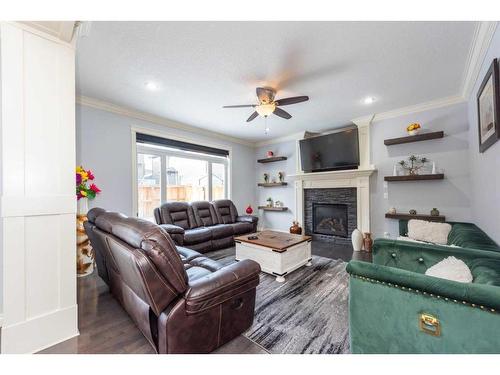 112 Kinniburgh Circle, Chestermere, AB - Indoor Photo Showing Living Room With Fireplace