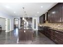 112 Kinniburgh Circle, Chestermere, AB  - Indoor Photo Showing Kitchen With Upgraded Kitchen 