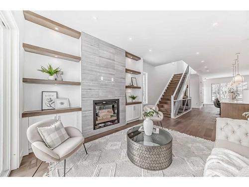 176 Lissington Drive Sw, Calgary, AB - Indoor Photo Showing Living Room With Fireplace