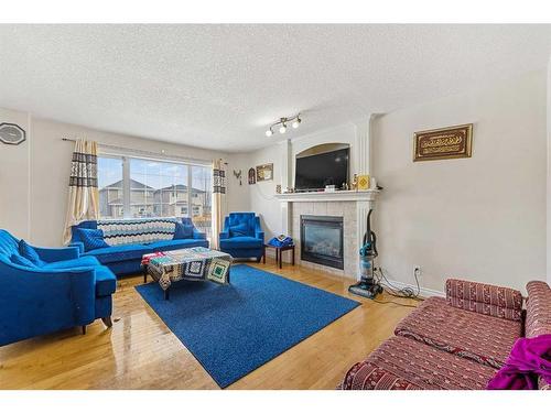 411 Taralake Way Ne, Calgary, AB - Indoor Photo Showing Living Room With Fireplace