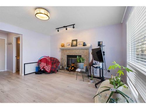 65 Scanlon Hill Nw, Calgary, AB - Indoor With Fireplace
