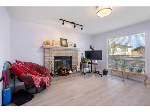 65 Scanlon Hill Nw, Calgary, AB - Indoor With Fireplace