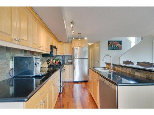 302-2306 17B Street Sw, Calgary, AB - Indoor Photo Showing Kitchen With Double Sink