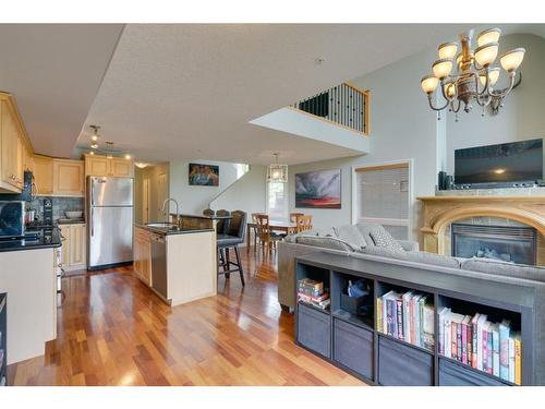 302-2306 17B Street Sw, Calgary, AB - Indoor Photo Showing Kitchen With Fireplace
